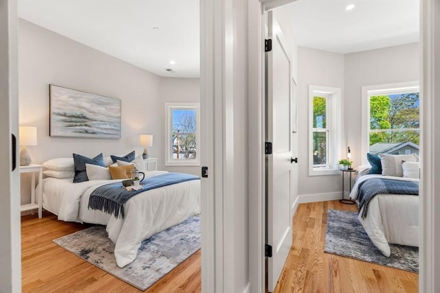 21 Ellington St Unit 3, Boston, MA 02121 - bedroom with light wood finished floors, recessed lighting, and baseboards