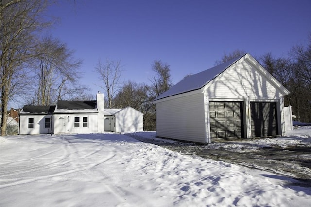 view of snow covered garage