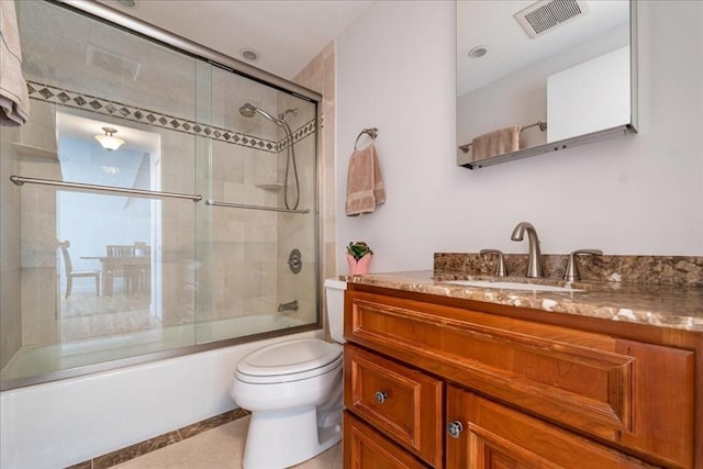 130 Appleton St Unit 4E, Boston, MA 02116 - full bathroom with vanity, toilet, combined bath / shower with glass door, and tile patterned floors
