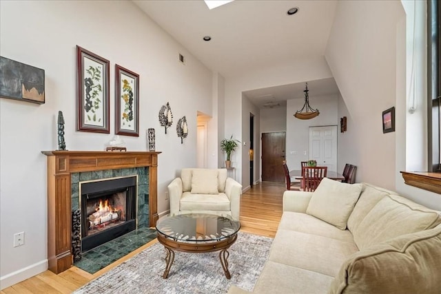 130 Appleton St Unit 4E, Boston, MA 02116 - living room with light wood-type flooring, a premium fireplace, and baseboards