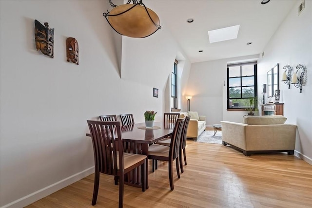 130 Appleton St Unit 4E, Boston, MA 02116 - dining space with a skylight, light wood-style floors, baseboards, and recessed lighting