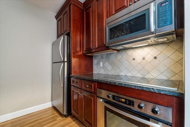 130 Appleton St Unit 4E, Boston, MA 02116 - kitchen featuring appliances with stainless steel finishes, dark brown cabinets, baseboards, tasteful backsplash, and light wood-style floors