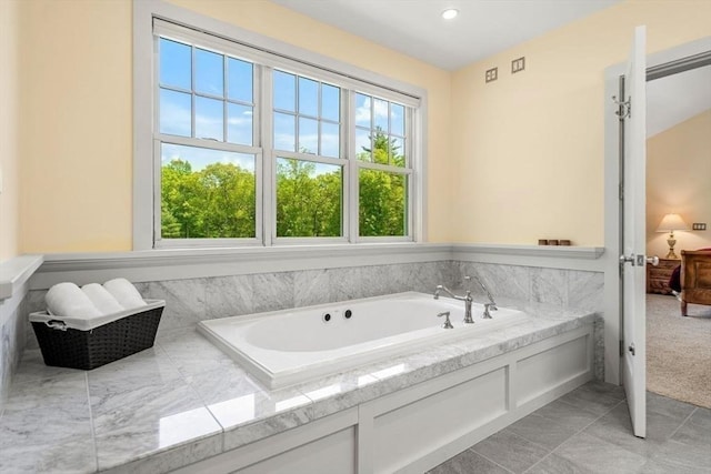 bathroom featuring recessed lighting and a garden tub