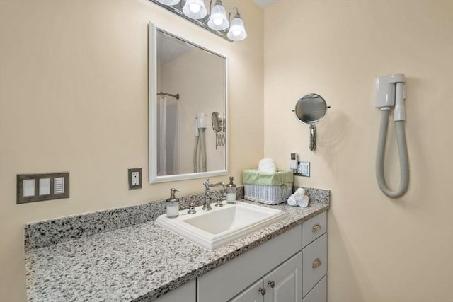 full bathroom with a shower with shower curtain and vanity