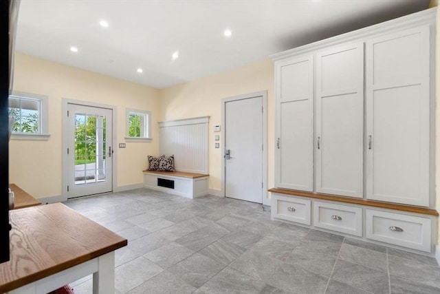 mudroom with baseboards and recessed lighting