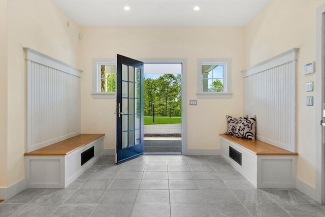 mudroom featuring light tile patterned floors, baseboards, and recessed lighting