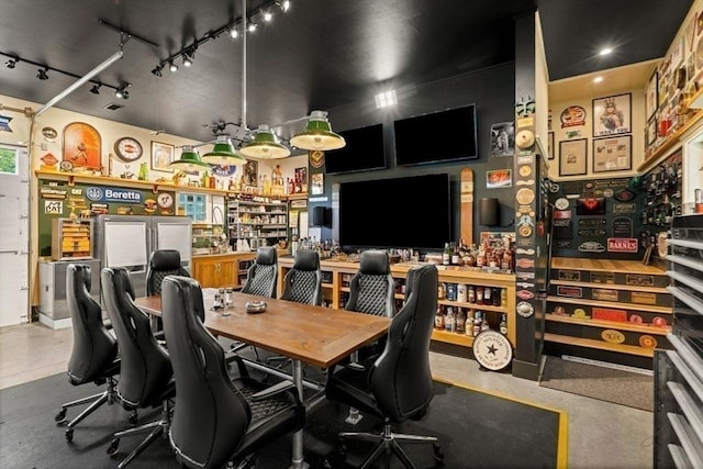 office space featuring a dry bar and finished concrete floors