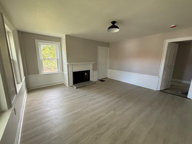 unfurnished living room with light hardwood / wood-style floors