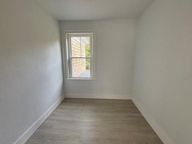 empty room with light hardwood / wood-style floors