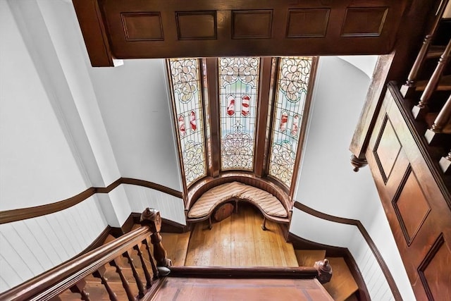 stairway with hardwood / wood-style flooring