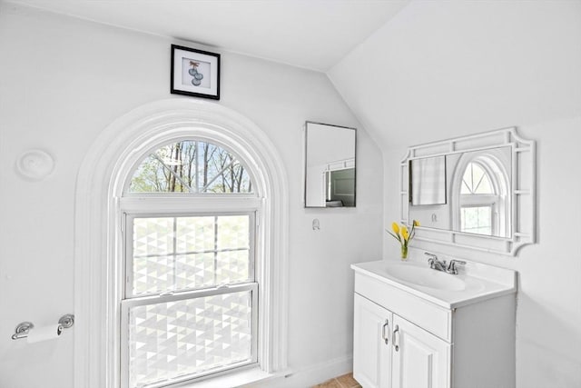 bathroom featuring vanity and vaulted ceiling
