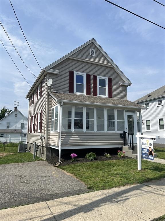 23 Walnut St, Ludlow, MA 01056 - view of front facade featuring a front yard and a shingled roof