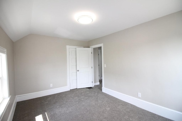 23 Walnut St, Ludlow, MA 01056 - carpeted empty room with vaulted ceiling and baseboards