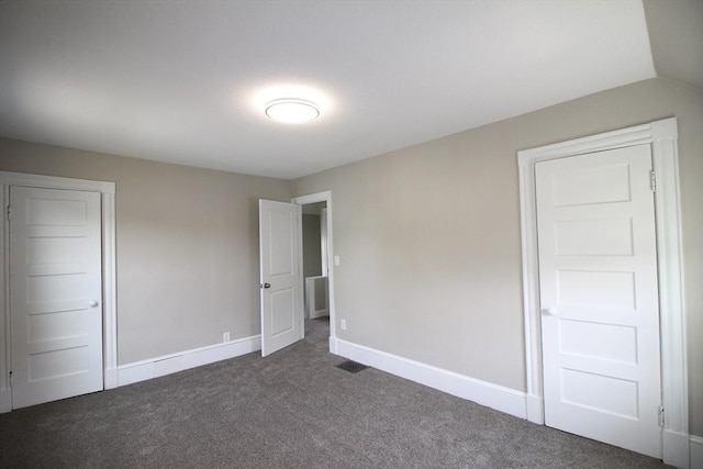 23 Walnut St, Ludlow, MA 01056 - unfurnished bedroom featuring dark colored carpet and baseboards