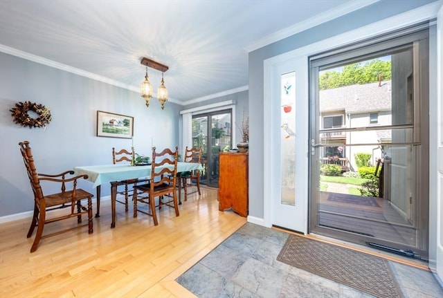 17 Ships Way Unit 17, Bourne, MA 02532 - dining room featuring crown molding, a chandelier, baseboards, and light wood-style flooring