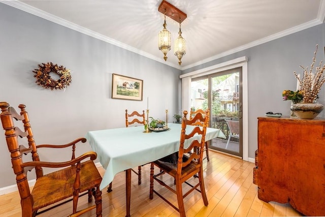 17 Ships Way Unit 17, Bourne, MA 02532 - dining room featuring light wood finished floors, a baseboard radiator, crown molding, and baseboards