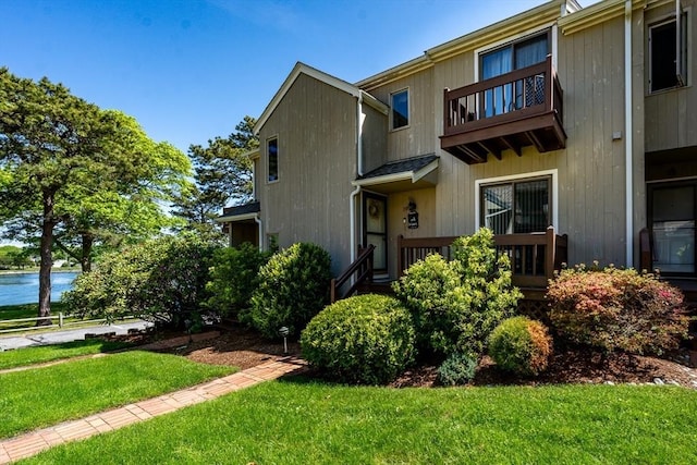 17 Ships Way Unit 17, Bourne, MA 02532 - view of property featuring a balcony, a front yard, and a water view