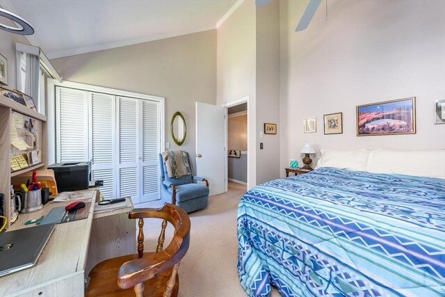 17 Ships Way Unit 17, Bourne, MA 02532 - bedroom with carpet, ornamental molding, a closet, high vaulted ceiling, and baseboards
