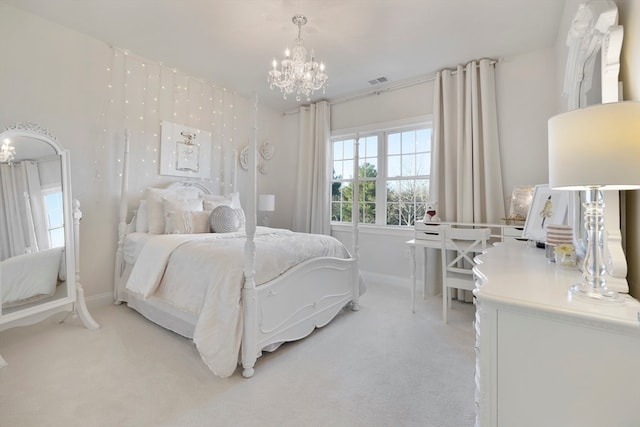 bedroom with light colored carpet and a notable chandelier