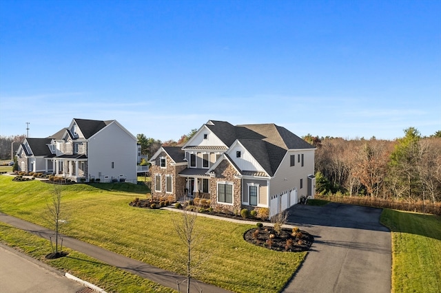 view of front facade with a garage and a front yard