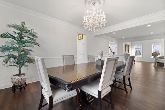 dining area featuring dark hardwood / wood-style flooring, an inviting chandelier, and ornamental molding