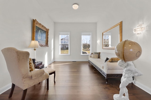 sitting room featuring dark hardwood / wood-style flooring and plenty of natural light