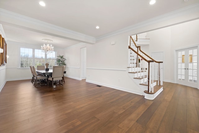 dining room featuring a chandelier, crown molding, and dark wood-type flooring