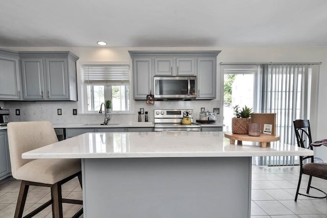 109 Macintosh Ln, Fitchburg, MA 01420 - kitchen with a sink, stainless steel appliances, and gray cabinets