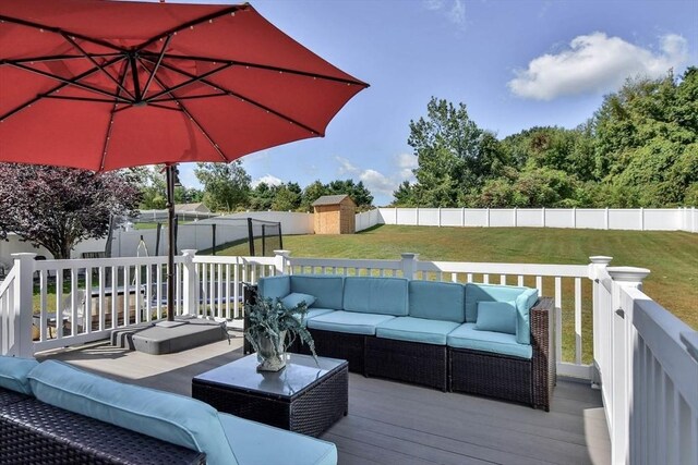 109 Macintosh Ln, Fitchburg, MA 01420 - wooden terrace featuring a storage shed, an outdoor structure, a yard, a fenced backyard, and outdoor lounge area