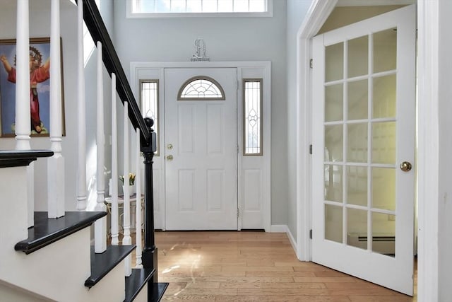 109 Macintosh Ln, Fitchburg, MA 01420 - entrance foyer featuring stairway, light wood-type flooring, and a healthy amount of sunlight