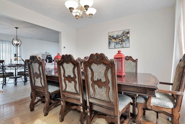 109 Macintosh Ln, Fitchburg, MA 01420 - dining space featuring light wood-style floors and a chandelier