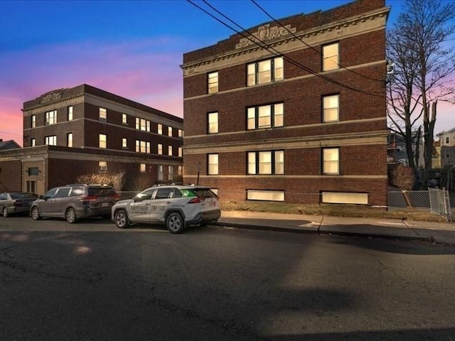 view of outdoor building at dusk