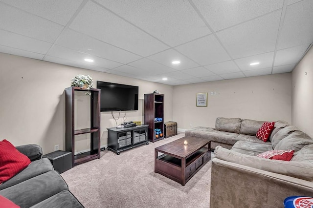 living room with baseboards, a drop ceiling, carpet flooring, and recessed lighting