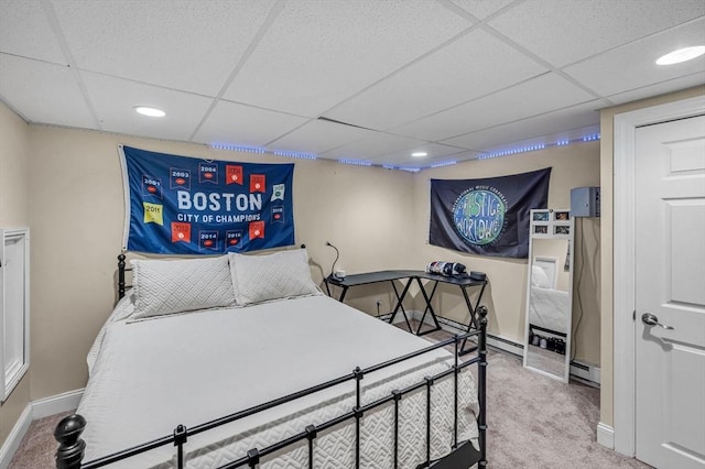 bedroom featuring carpet, a drop ceiling, baseboards, and recessed lighting