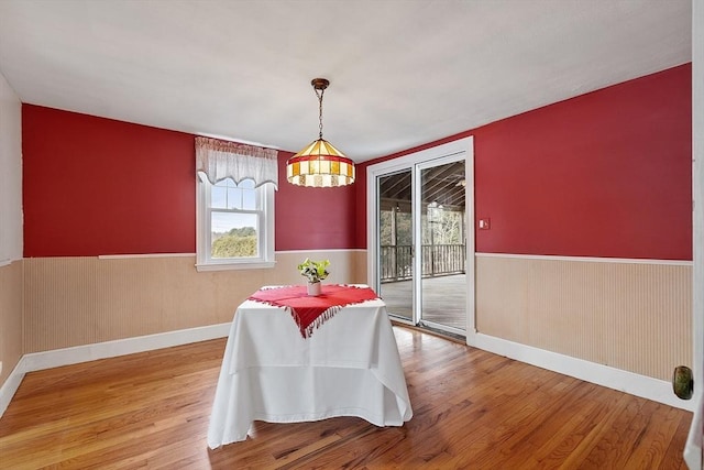 unfurnished dining area featuring hardwood / wood-style floors