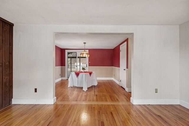 unfurnished dining area featuring light wood-type flooring