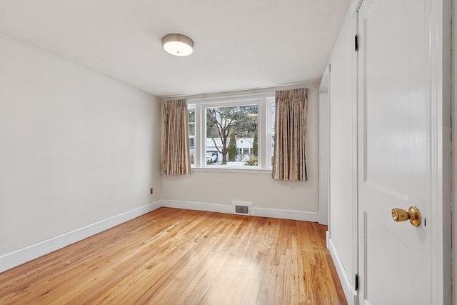 spare room featuring light hardwood / wood-style flooring