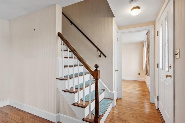 stairway with wood-type flooring