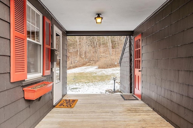 doorway to outside featuring hardwood / wood-style flooring and plenty of natural light