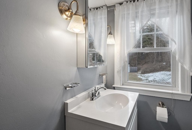 bathroom featuring plenty of natural light and vanity