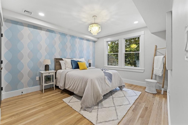 34 Walker St, Somerville, MA 02144 - bedroom with wallpapered walls, an accent wall, baseboards, light wood finished floors, and recessed lighting