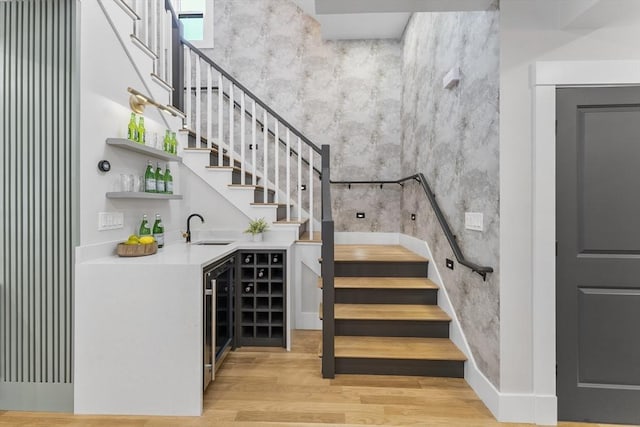34 Walker St, Somerville, MA 02144 - indoor wet bar featuring stairs, wood finished floors, and beverage cooler