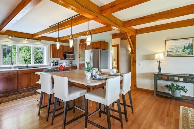 15 Allen Hill Rd, Princeton, MA 01541 - dining area with beam ceiling, light wood finished floors, and baseboards