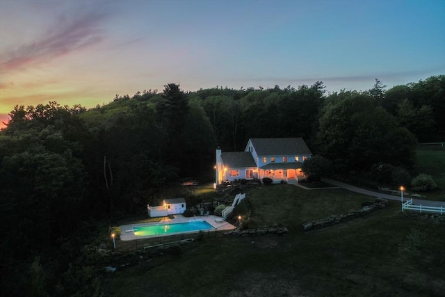 15 Allen Hill Rd, Princeton, MA 01541 - pool at dusk with a yard, an outdoor pool, and a wooded view