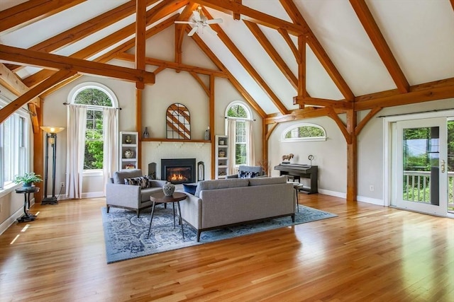 15 Allen Hill Rd, Princeton, MA 01541 - living room with high vaulted ceiling, plenty of natural light, beamed ceiling, a glass covered fireplace, and a ceiling fan