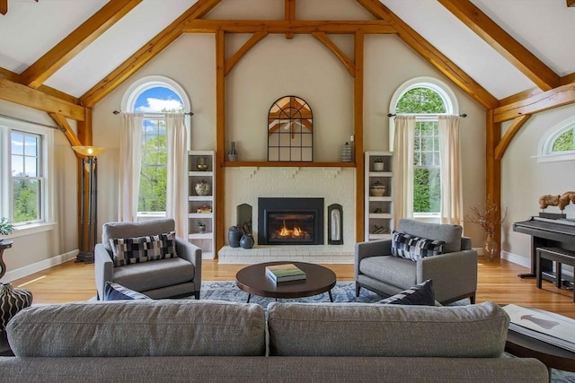 15 Allen Hill Rd, Princeton, MA 01541 - living area with healthy amount of natural light, high vaulted ceiling, beam ceiling, wood finished floors, and a fireplace