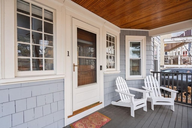 wooden terrace with a porch