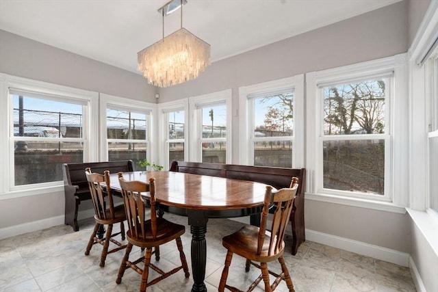 sunroom with a chandelier