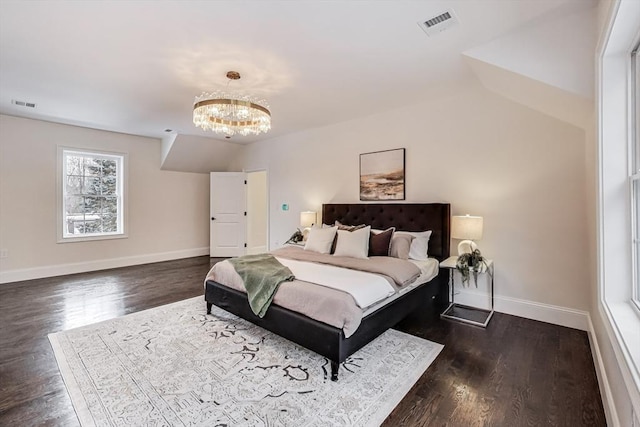 bedroom with a chandelier, visible vents, baseboards, and dark wood-style floors