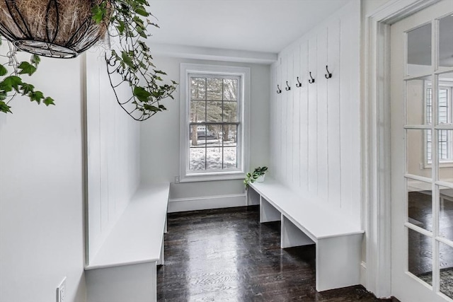 mudroom featuring dark wood-style flooring and baseboards